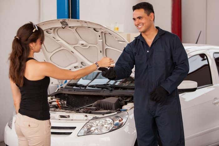 Car Owner Speaking to Technician