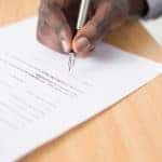 Person Signing Paperwork