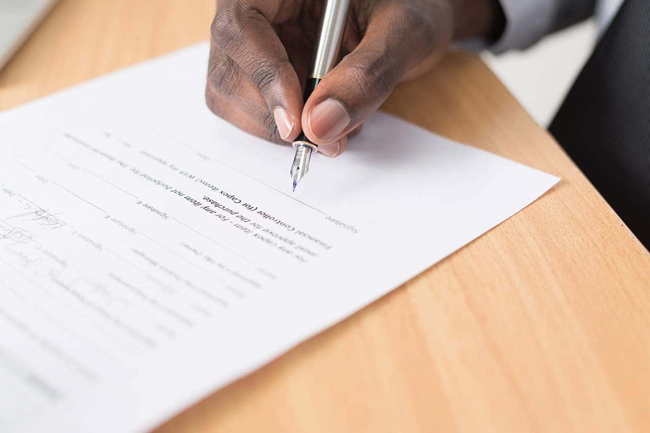 Person Signing Paperwork