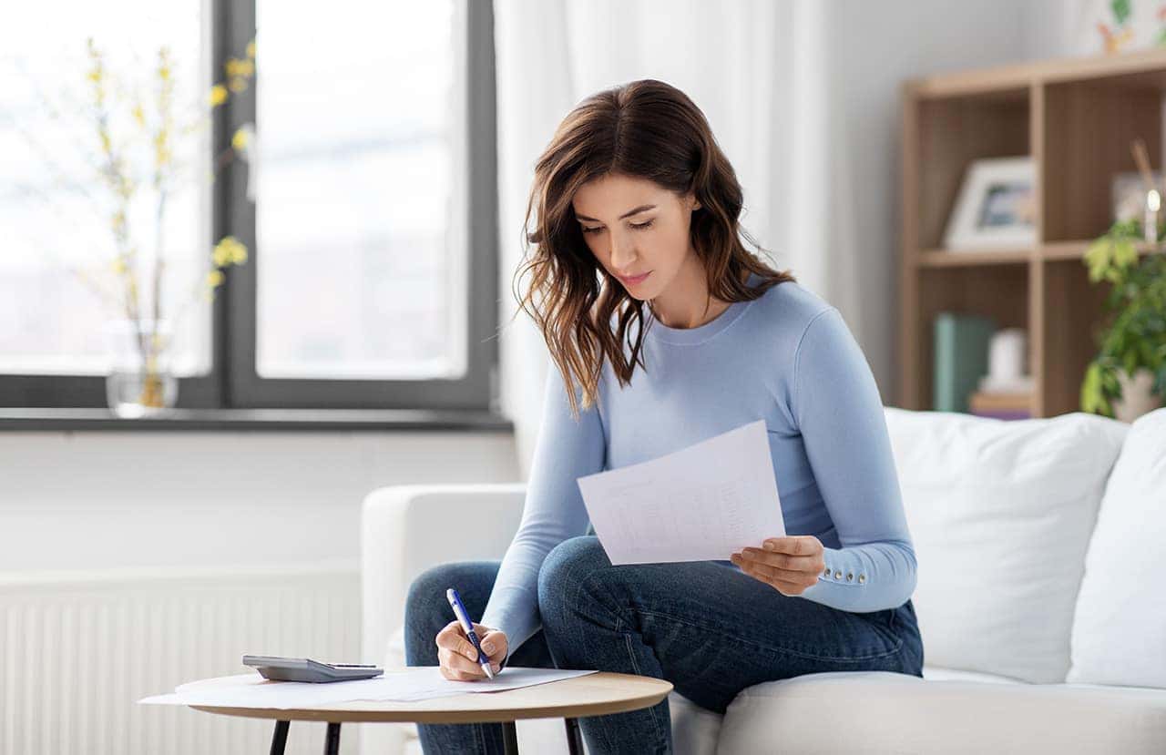 Woman examining paperwork