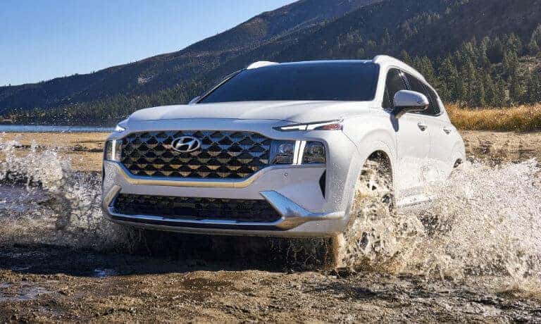 2022 Hyundai Santa Fe driving through a river