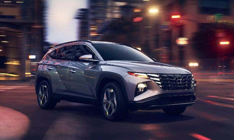 2022 Hyundai Tucson driving in the city at night