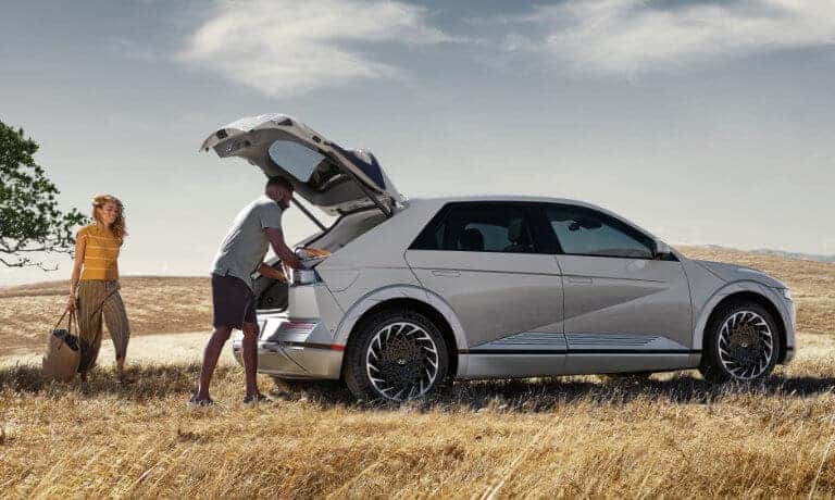 2024 Hyundai Ioniq 5 with people loading cargo into trunk