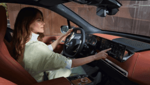 Woman sitting in BMW IX customizing screen