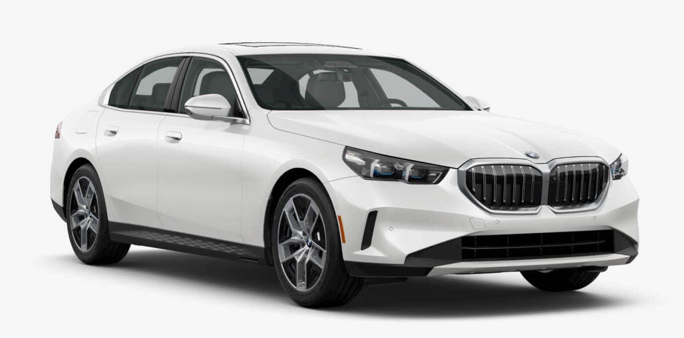 BMW 530i xDrive Sedan in Mineral White Metallic shown in three-quarter angle.