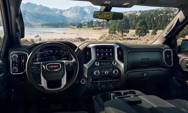 GMC Sierra 1500 front row with a view of trees and mountains