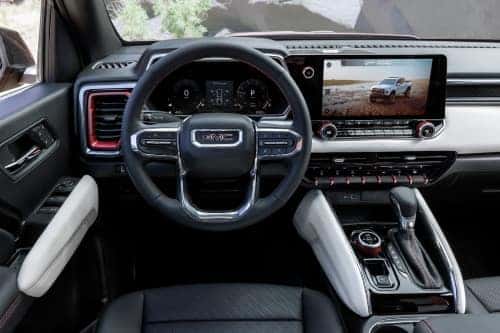 2023 GMC Canyon AT4x Edition 1 steering wheel and head up display.