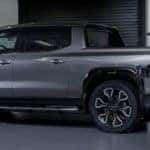 2024 GMC Sierra EV Denali Edition 1 Exterior Driver Side Rear Profile while Charging_o