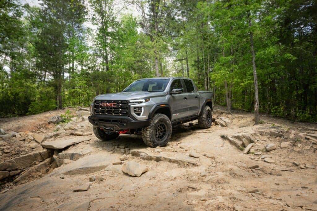 2024 GMC Canyon AT4X AEV Parked 3/4 Front View in a Forest