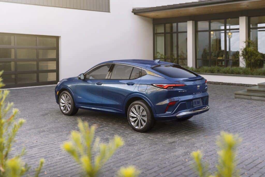 Rear 7/8 view of the 2024 Buick Envista Avenir in Ocean Blue Metallic. Preproduction model shown. Actual production model may vary. Available in summer 2023.
