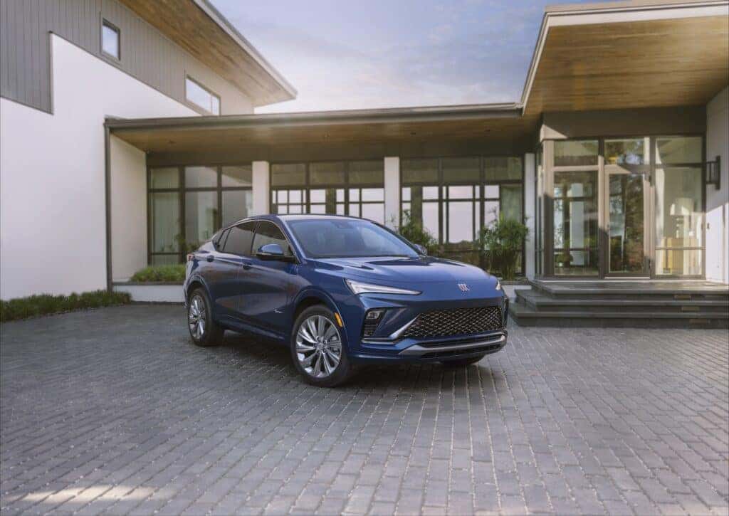 Front 3/4 view of the 2024 Buick Envista Avenir in Ocean Blue Metallic. Preproduction model shown. Actual production model may vary. Available in summer 2023.