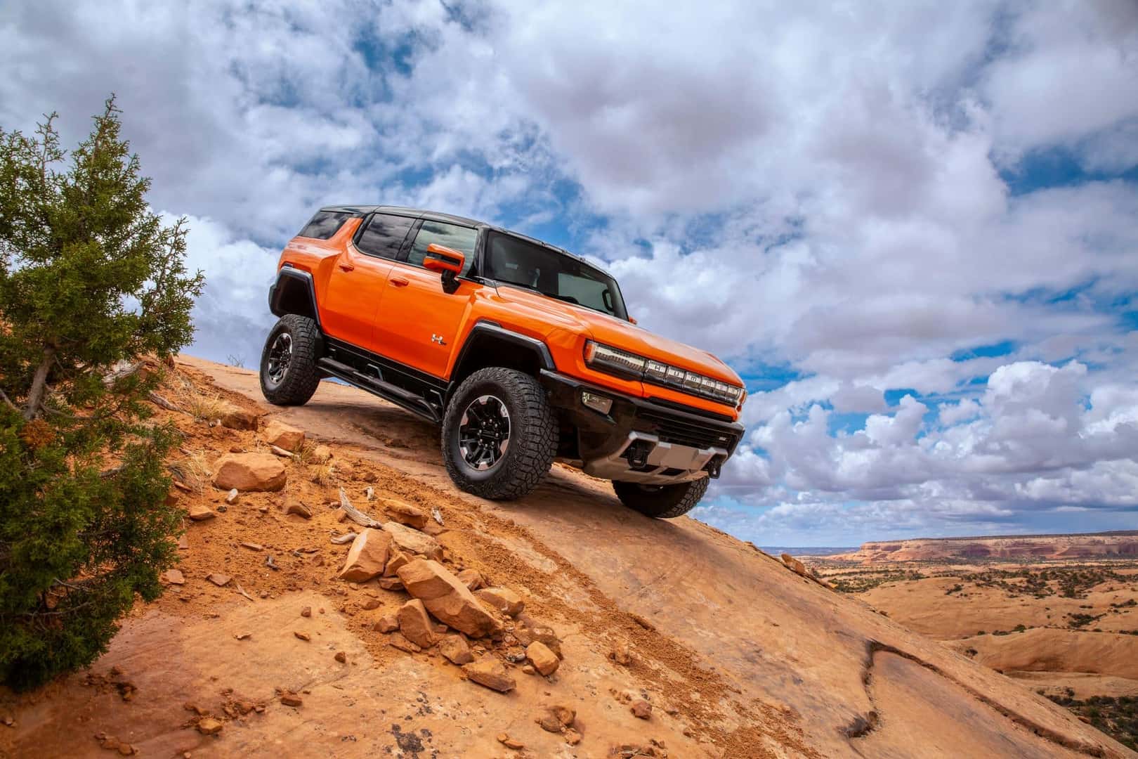 The Intimidating 2024 GMC Hummer EV SUV Racing Down A Hill Off-Road