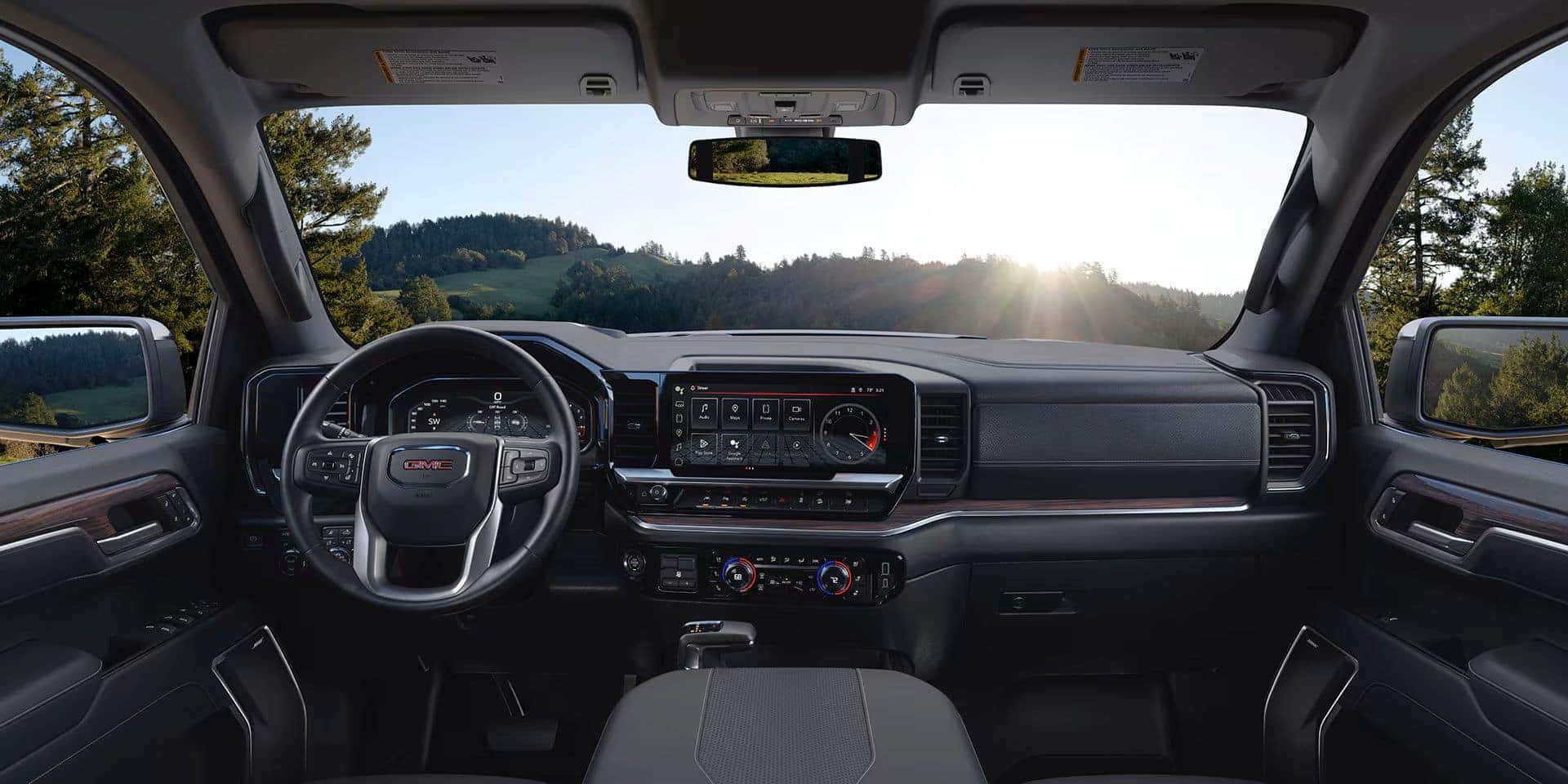 The 2025 Sierra 1500's Spectacular Front Interior, With The Sun Shining Through The Windshield