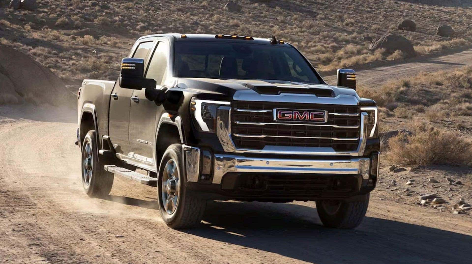 The Speeding GMC Sierra HD, Blowing Off Dirt On The Country Roads