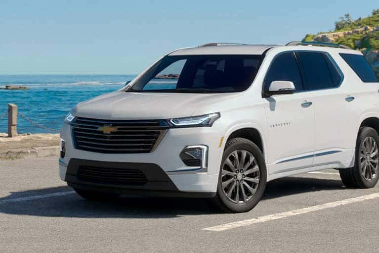 2023 White Chevrolet Blazer parked in front of a beach walk
