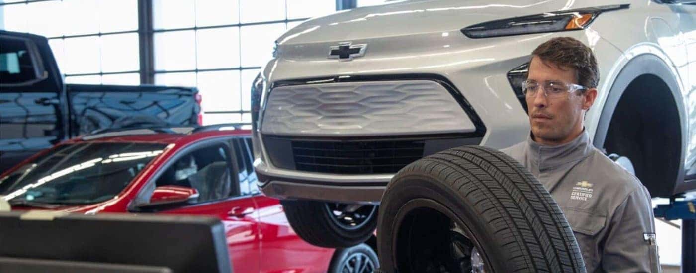 A white 2023 Chevy Bolt EV tire service.