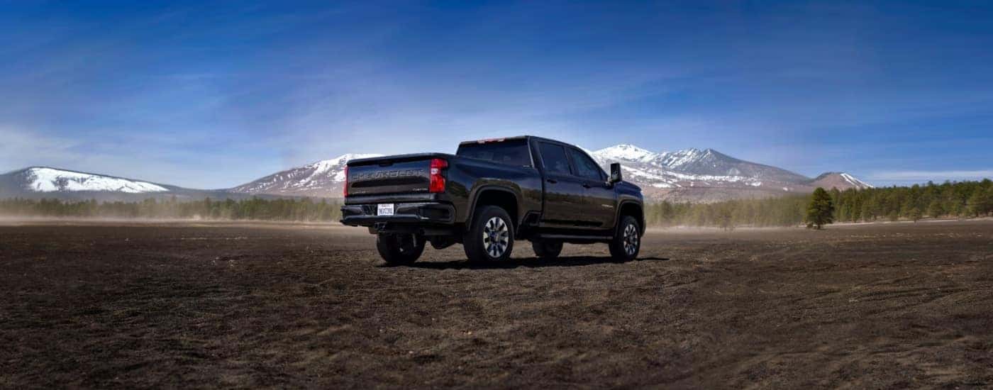 Black 2026 Chevy Silverado 2500 HD Custom parked off-road