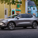 2024 Chevy Equinox EV Driving through city.