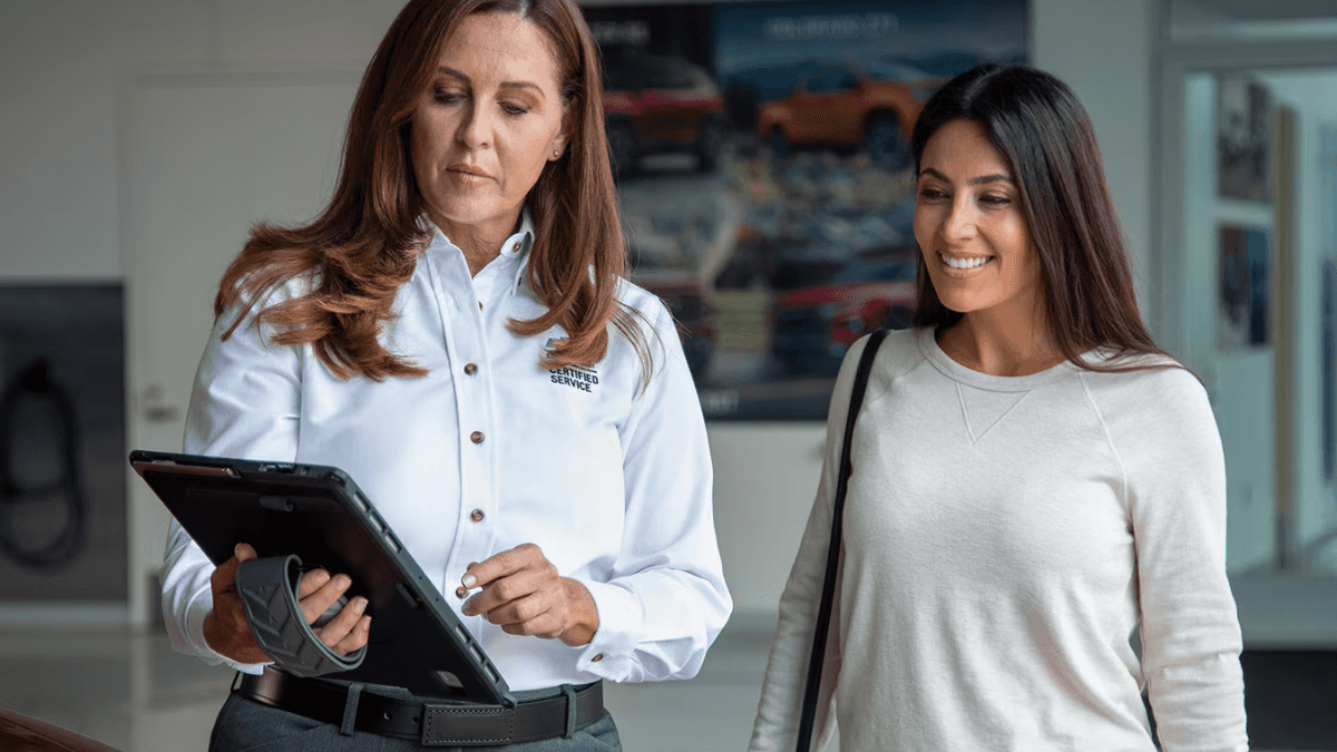 Customer viewing a vehicle with a sales consultant