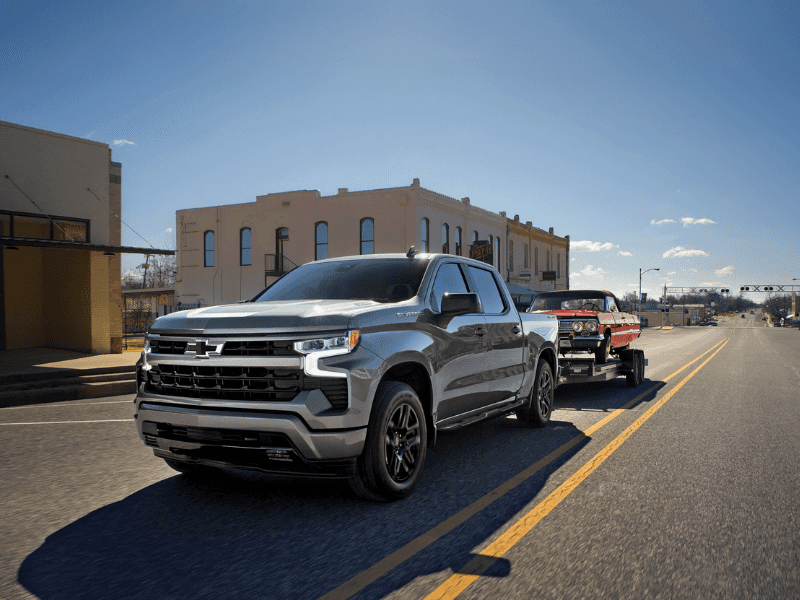 Chevrolet Silverado towing a classic vehicle