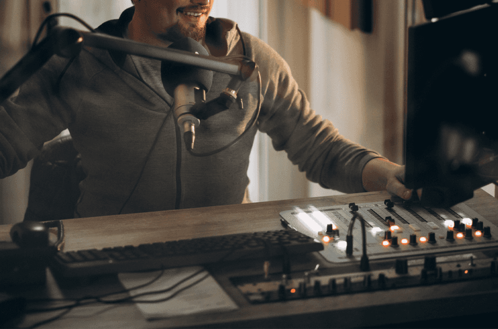 Chevy Dealer near Pittsburgh | Person working at a radio station with audio equipment