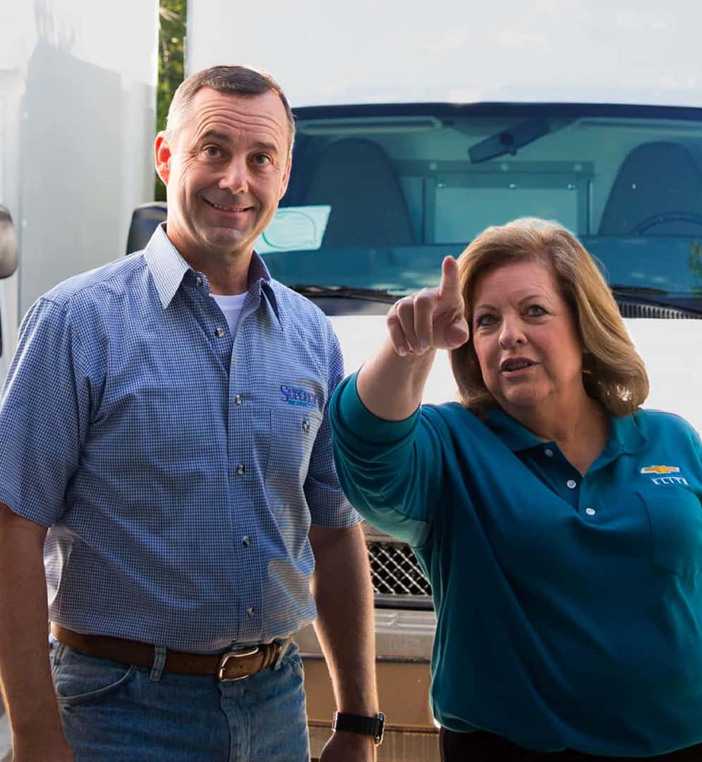 Man and woman at car dealership