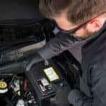 Buick service technician installing a battery