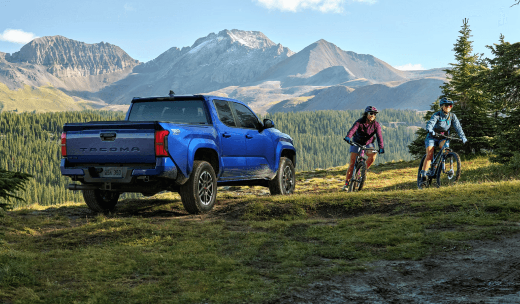 new toyota tacoma blue parked near mountains