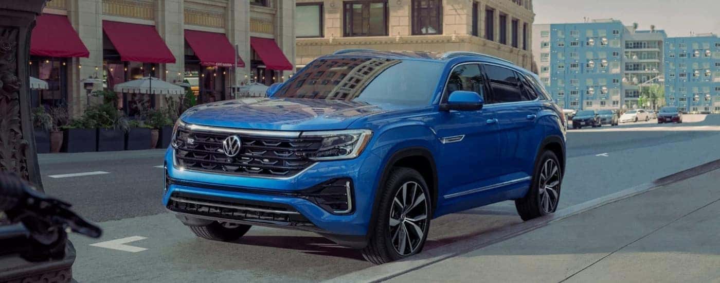 A blue 2025 Volkswagen Atlas from the front at an angle.