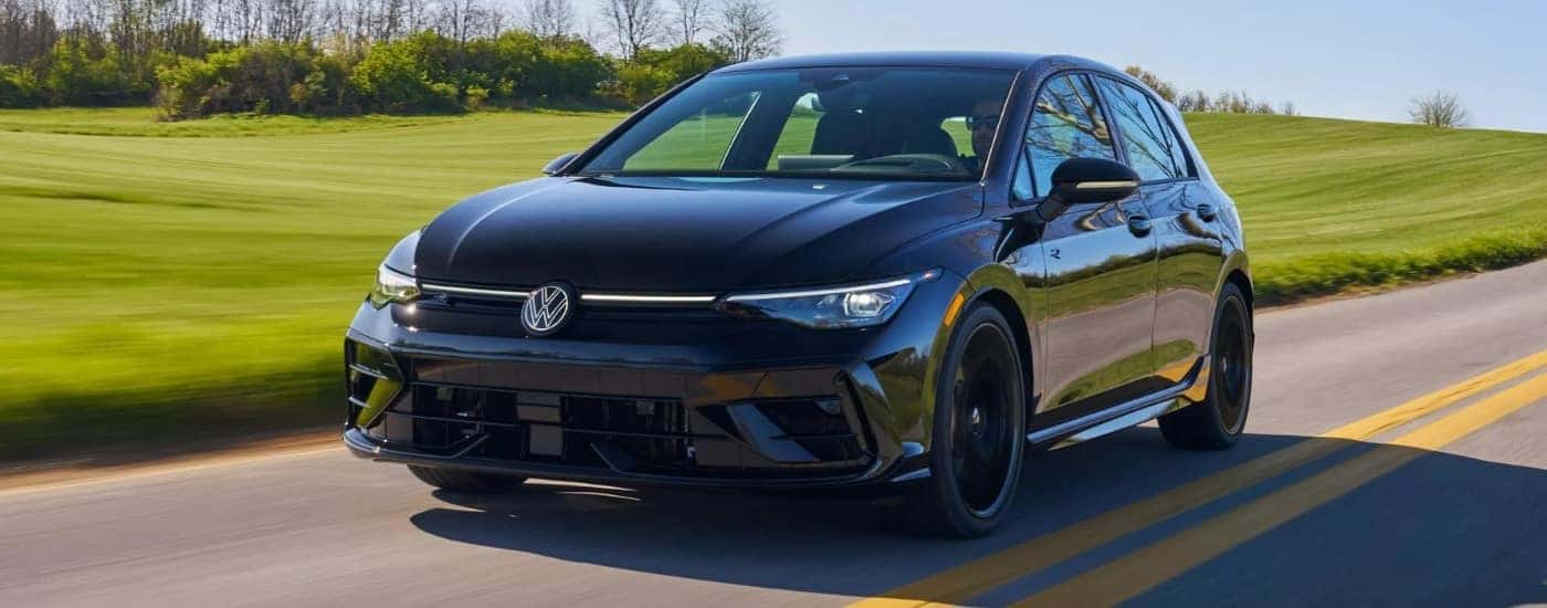 A black 2025 Volkswagen Golf R from the front at an angle.