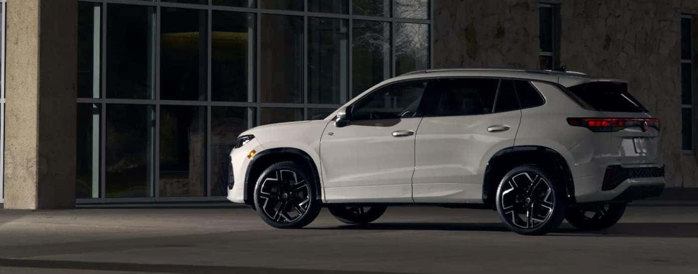 A white 2025 Volkswagon Tiguan parked near a building