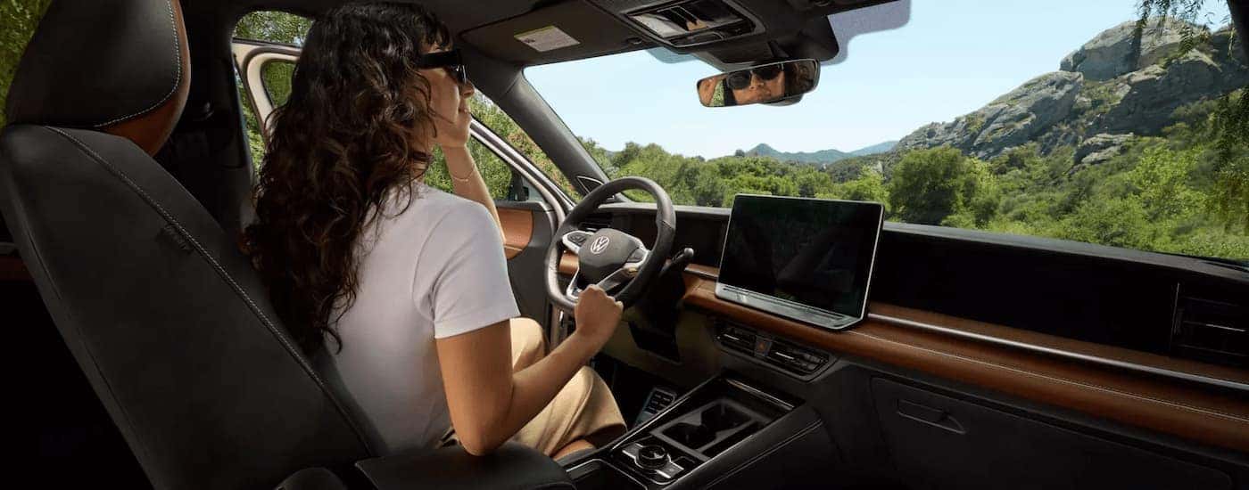 Woman driving in a 2025 Volkswagen Tiguan for sale