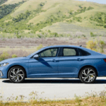 Blue 2026 Volkswagen Jetta for sale from the side.