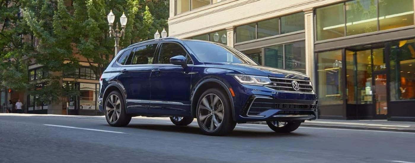 Blue 2023 Volkswagen Tiguan parked outside a Volkswagen dealer near Carpentersville