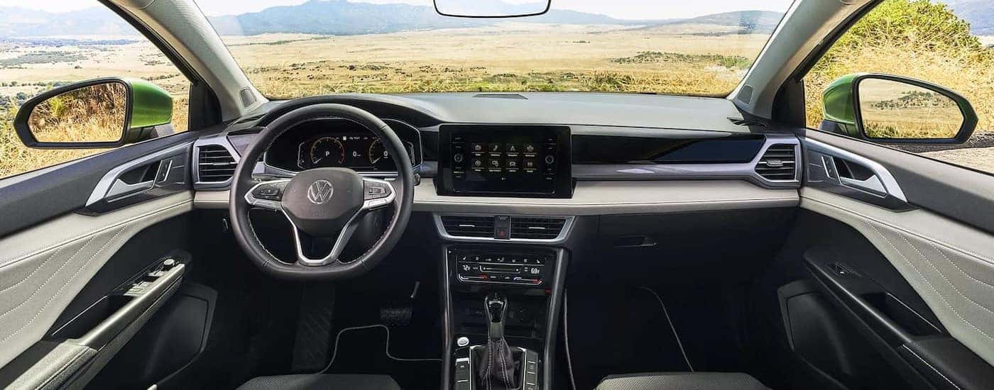 The gray dash in a 2025 Volkswagen Taos for sale near Elgin.