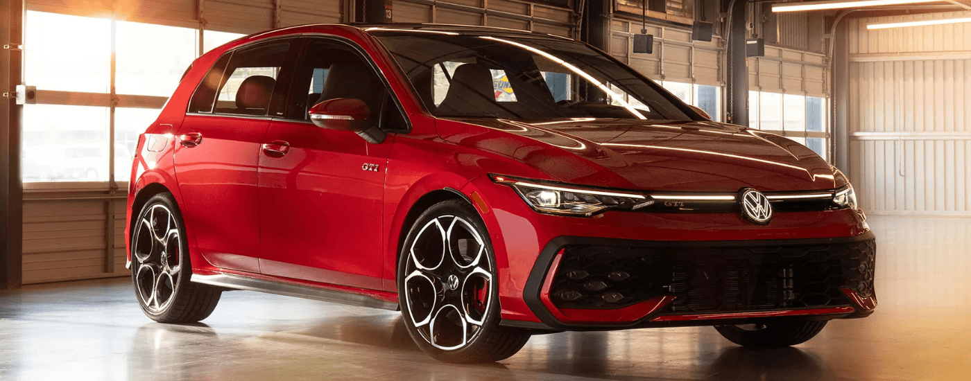 Red 2026 Volkswagen Golf GTI angled left
