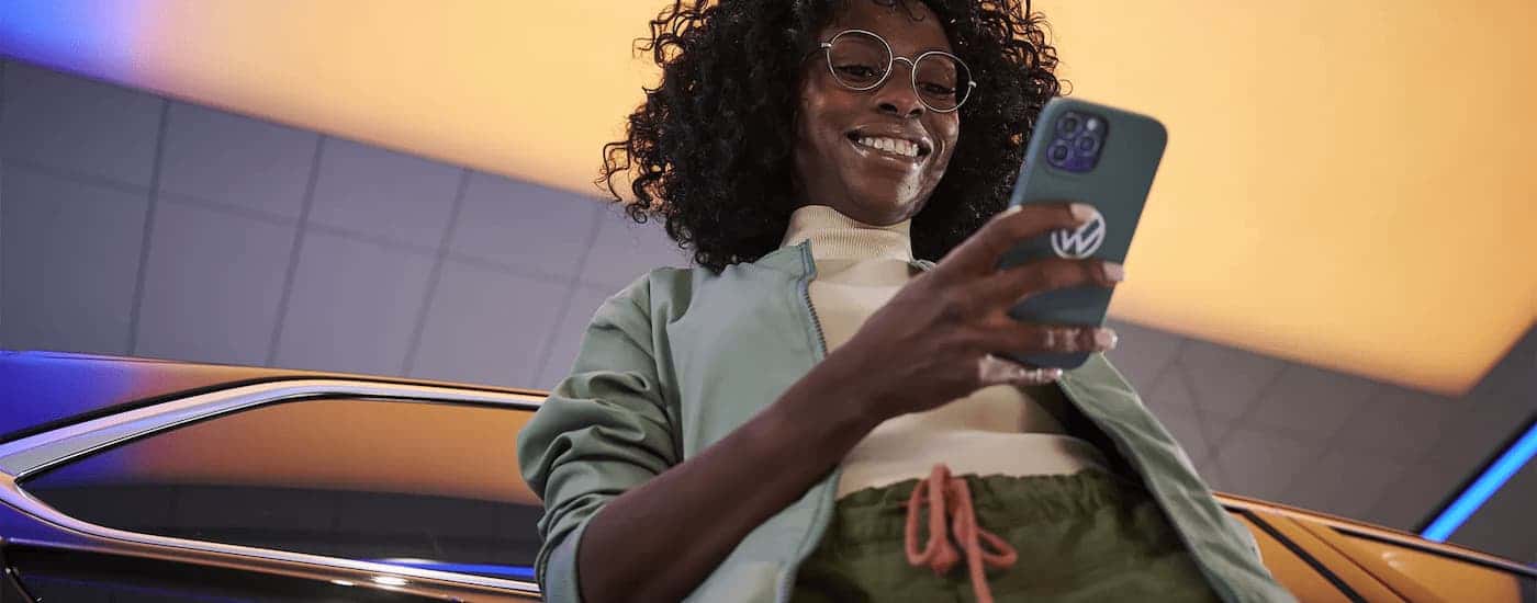 Woman smiling at cellphone