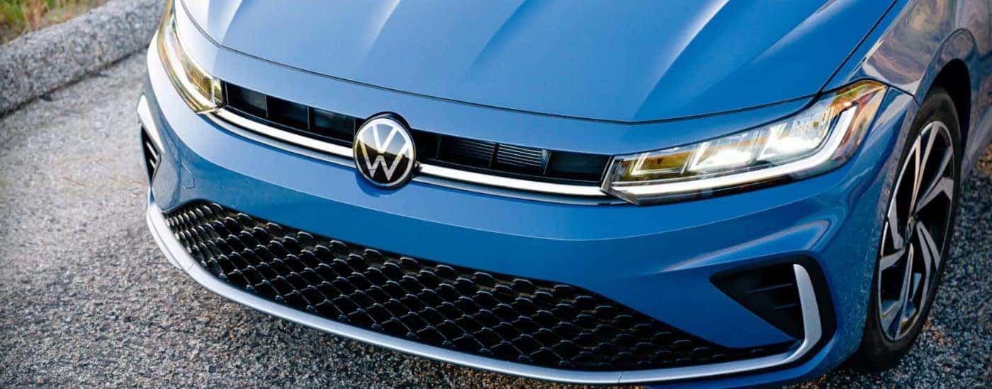 Front bumper of a blue 2025 Volkswagen Jetta.