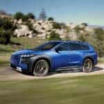 2026-Subaru-Trailseeker-EV-driving-on-highlands