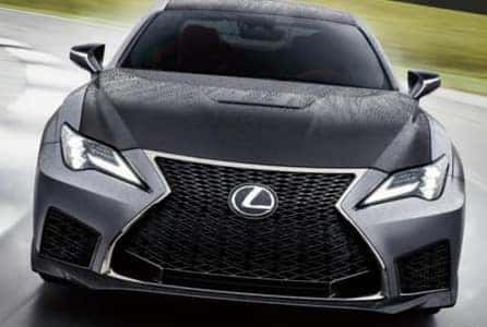 A Lexus driving through rain