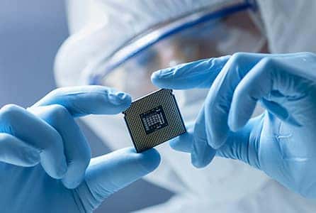 A person holding a semiconductor