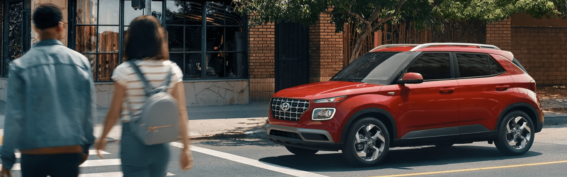 2024 Hyundai VENUE in red stopping couple turning heads