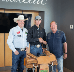 john vance standing beside rodeo champion clint graves