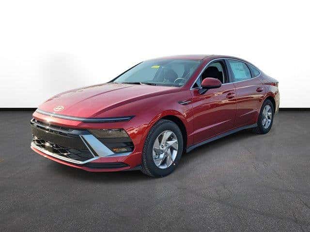 2026 Hyundai Sonata in red, front three-quarter view, at Joseph Airport Hyundai in Dayton, Ohio