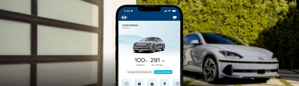 Driver using Hyundai Bluelink app to start the car remotely in winter