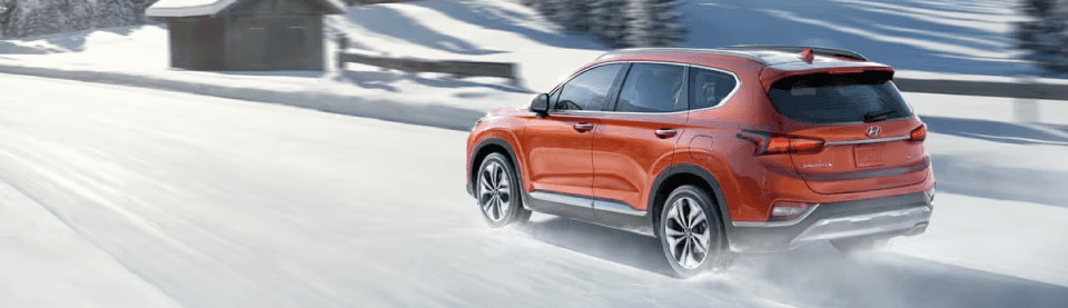 Hyundai SUV with HTRAC all-wheel drive on a mountain road