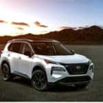 2023 Nissan Rogue seen with mountains and sunset in background