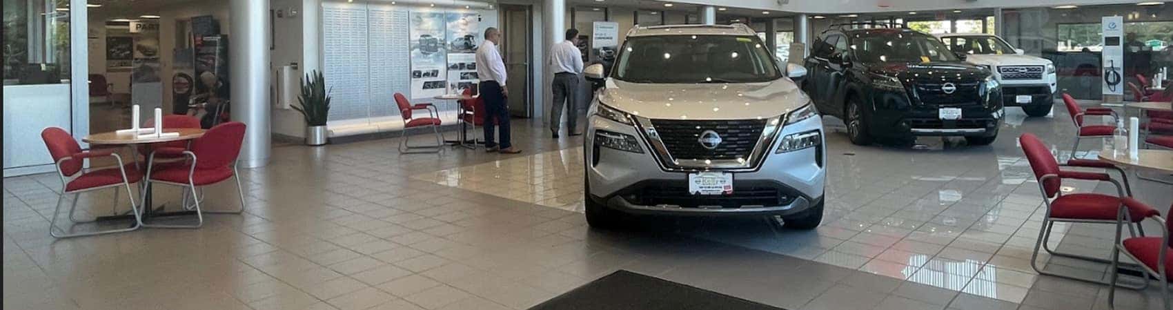 New Nissan vehicles in Kelly Nissan of Woburn showroom