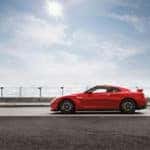 New 2023 Nissan GT-R in red driving down highway