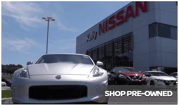 Pre-Owned Nissan vehicles shown outside of Kelly Nissan of Woburn near front entrance